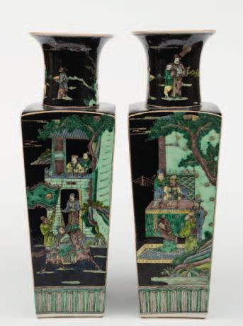 569 A pair of Chinese celadon glazed bottle vases each decorated in white enamel with butterflies, 42 cm high.