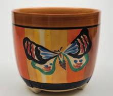 608 A Clarice Cliff Fantasque jardiniere of Dover shape enamelled in the Butterfly pattern, Fantasque backstamp, circa 1929-30,19.5 cm high, [light interior wear].