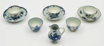 100-150 628 A group of Worcester First Period porcelain comprising three tea bowls, a saucer and cream jug printed in blue in Fruit Sprigs pattern, hatched crescent marks, circa 1770-80, together