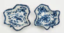 (9) 150-200 629 A pair of Worcester First Period porcelain pickle dishes of leaf shaped form each painted in blue with a variation of the Pickle Leaf Vine pattern, open crescent marks, circa 1760-70,