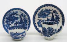 60-90 631 A Worcester First Period porcelain tea bowl and saucer and similar Liverpool cup and saucer the former printed in blue in the Fisherman and Cormorant pattern, hatched crescent mark, circa