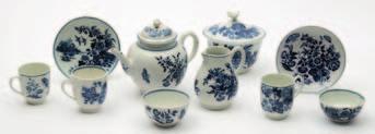 80-100 632 A group of Worcester First Period porcelain comprising an unusual small mug printed and painted in blue with four lace bordered panels of flowers and butterflies, the interior with a cell