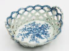 643 A Worcester First Period porcelain basket of pierced oval form, the rope handles with leafy terminals, the exterior applied with