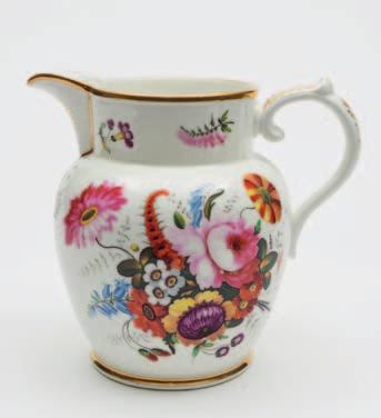 150-200 655 A Coalport porcelain presentation jug of bulbous form with ribbed foliate capped handle and thumb rest enamelled front and verso with bouquets and scattered sprays, beneath the spout a