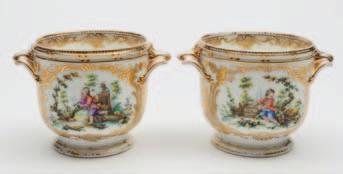 300-500 658 A pair of English, probably Minton seaux each of footed form with foliate handles and ribbed rim, each enamelled with children in a landscape reserved on a gilt