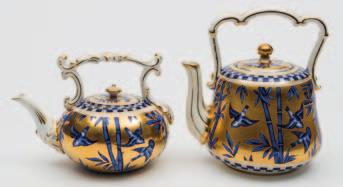 150-250 659 Two Coalport porcelain tea kettles one of squat form with foliate moulded handle and spout, the latter of tapering cylindrical form with overhead handle and lobed