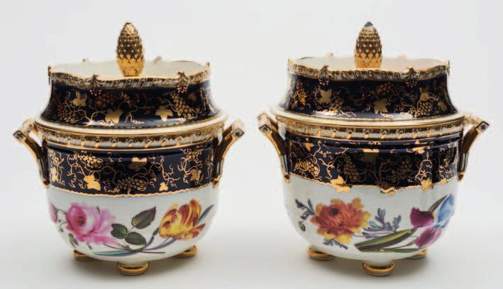 661 A pair of Coalport porcelain Union ice pails and covers of circular form with angular handles on four bun feet, with gadrooned rims, the covers with a pinecone knop, enamelled with a band of