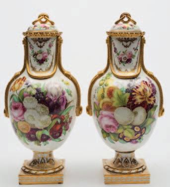 200-300 663 A pair of Coalbrookdale vases and covers in the French manner, each oviform body with simulated gilt rope swags and domed cover with chain link