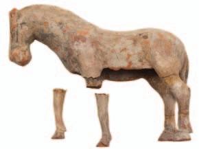 510 A small Chinese painted terracotta figure of a horse standing four-square, Tang Dynasty, 15 cm high [some damage and repair].