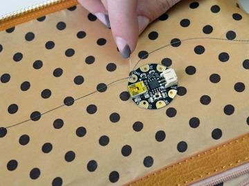 Stitch Sequins Clean off your work space and turn your bag inside out.
