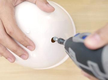 Drill Hole Use a rotary power tool with a drill bit to make a pilot hole.