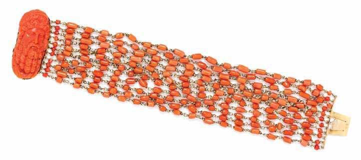 $1,000-2,000 5 a Yellow Gold and coral Festoon necklace, containing one reddish orange coral cameo depicting a Classical bearded male proile and measuring approximately 24.17 x 20.