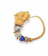 Property from the Estate of Olga Hirshhorn, Naples, Florida $200-400 376 a Yellow Gold and Faience Ra, Egyptian, likely of modern manufacture,