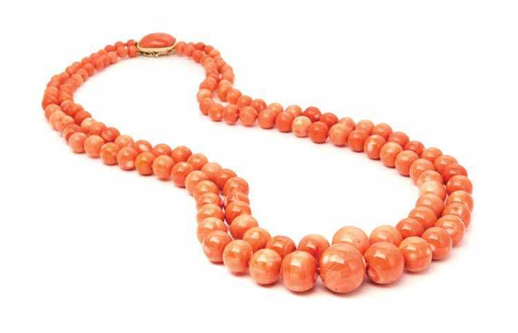 38 40 39 38 a Double Strand coral Bead necklace, consisting of two strands containing numerous mottled pinkish orange coral beads measuring approximately 5.83-18.