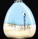 Our Beach Horizon pendant features ivory glass (sand) and turquoise glass (ocean).