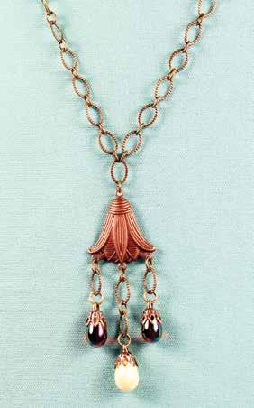 50 Lotus Blossom Necklace (26") An antique brass Lotus Blossom holds two Ruby Carnival Glass drops and one Ivory Carnival Glass drop (21/2") to create a stunning
