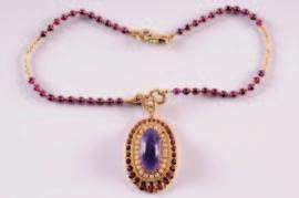 An 18ct gold, amethyst, garnet and cultured seed pearl pendant with central