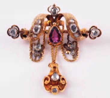A mid 19th century gold, rose diamond and garnet mounted brooch of stylised ribbon design with engraved foliate decoration,