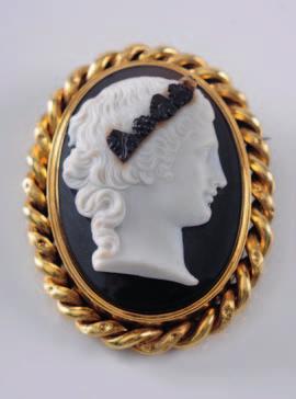 woman wearing a pearl necklace within a black enamel and seed-pearl set frame with Paris control