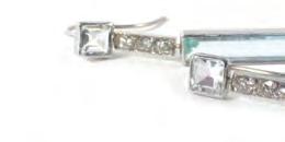 Lot 662 662 A pair of white metal ear pendants, each set baguette cut aquamarine