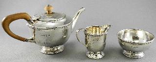 Art Deco silver and opal ring. 482 483 484 485 486 487 488 489 Good quality three piece hallmarked silver hand beaten tea service. Sterling silver salt shaker.