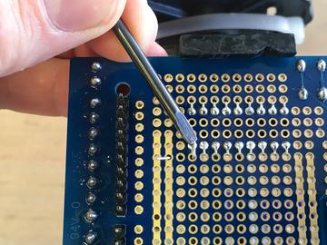 is bent over to contact the pin before soldering to the Darlington pin