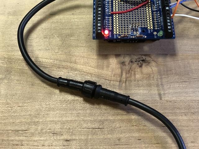 Plug in your 12V power supply to the DC jack on the Metro M0, and turn on the small on
