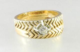 $500 - $750 492 493 14kt. gold and diamond engagement ring with matching wedding band.