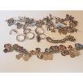 142A. Collection of silver items to include 3 charm bracelets and rings.