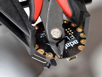 Use flush snips to clip off the excess wire on the