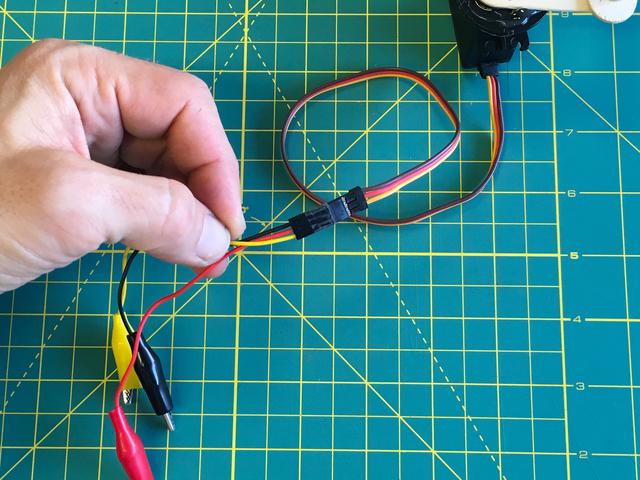 the servo cable housing: Black to Brown Red to Orange Yellow to Yellow Connect the alligator clips to the Circuit Playground Express pads: Red to 3.