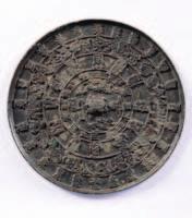long, Meiji period 600-800 463 A Chinese bronze circular mirror, the centre cast as a crouching beast, enclosed by