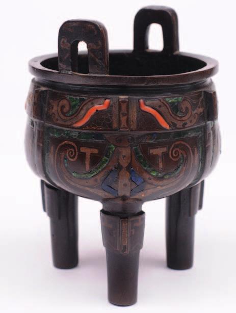 138 465 A Chinese archaistic inlaid bronze tripod censer, cast with flanges, inset with gold-coloured inlay, malachite, turquoise and coral,