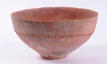 469A An early Bronze Age thinly potted grain bowl, of circular form with a single band of beaded