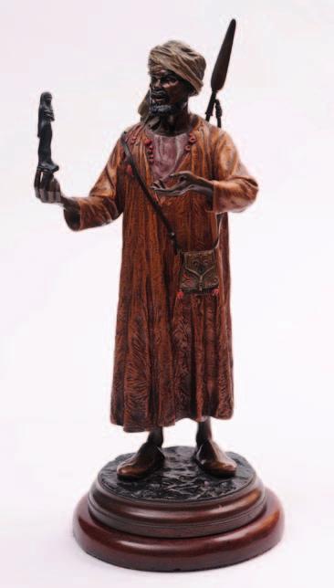 471 An Austrian cold painted bronze study of an Arab merchant holding a small Egyptian statue in his right hand,
