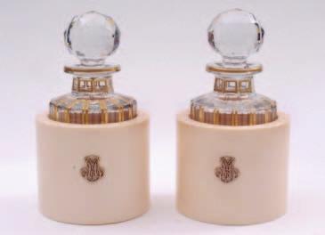 480 A pair of ivory bottle coasters of cylindrical form with applied