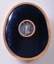 500-700 486 A late 18th century gilt metal and enamel oval buckle, the centre inset with a pale blue jasper ware cameo depicting