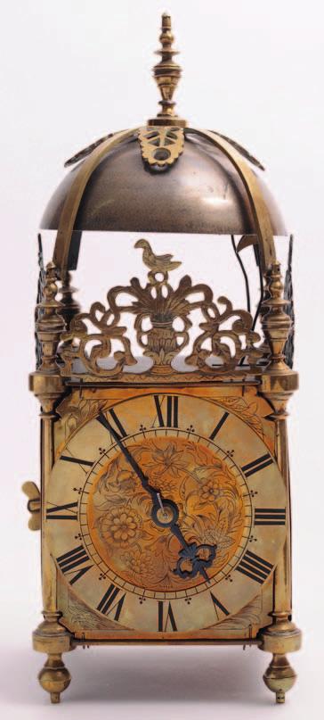 495 A mid Victorian brass lantern clock with an eightday, double fusee movement striking the hours and quarters on two bells set below the bell strap, the six-inch dial having a raised chapter ring