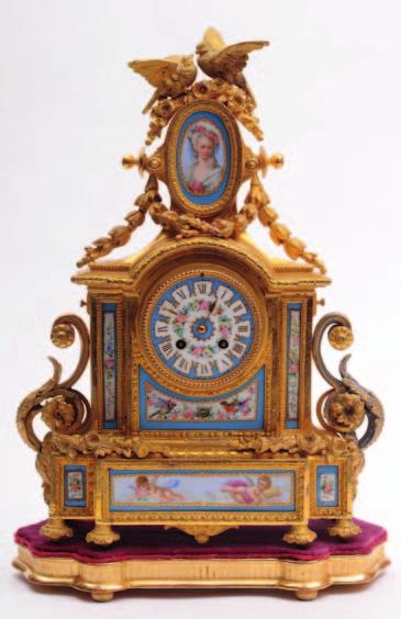 497 497 Japy Fils a Paris, a 19th Century French gilt metal and porcelain mounted mantel clock with an eightday duration movement striking the hours and half hours on a bell with an outside