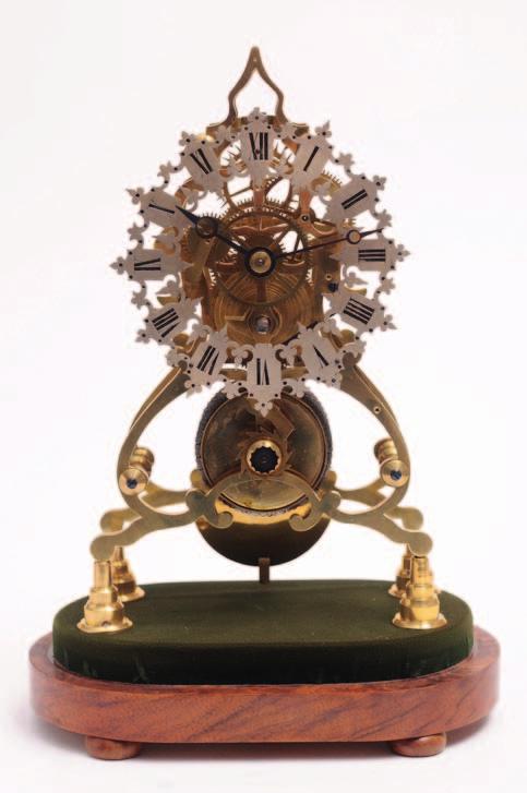 158 505 A mid Victorian scroll framed English skeleton clock with an eight-day duration, chain fusee movement, the silvered