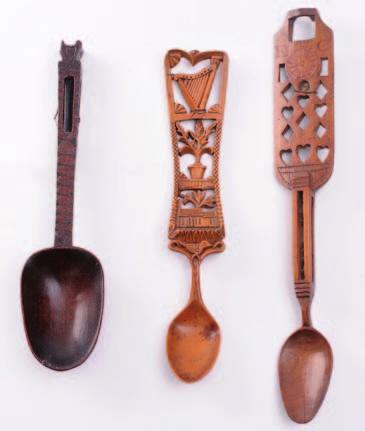 300-400 411 A 19th century Welsh treen love spoon, with ovoid bowl, the stem with fret cut decoration a harp, flowering shrub, chapel and a love bird, 31.5cm. long.