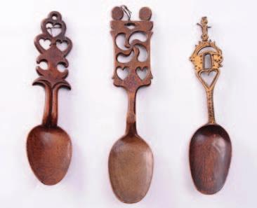 413 A Welsh treen love spoon with ovoid shaped bowl, having a heart, crown and key terminal, 19cm.