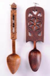 150-250 416 A Welsh treen love spoon, with ovoid shaped bowl, lantern stem containing three balls and square finial, 29cm.