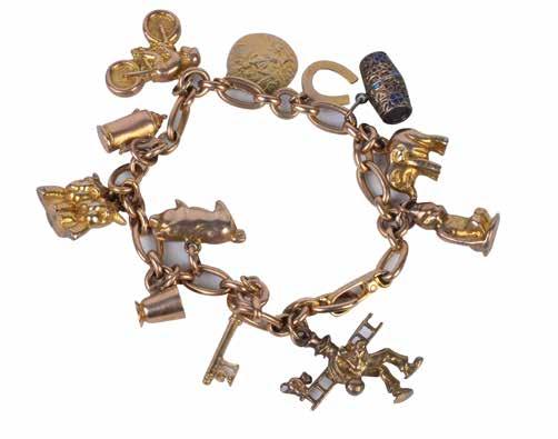 R3 000 Lot 424 9ct gold charm bracelet with