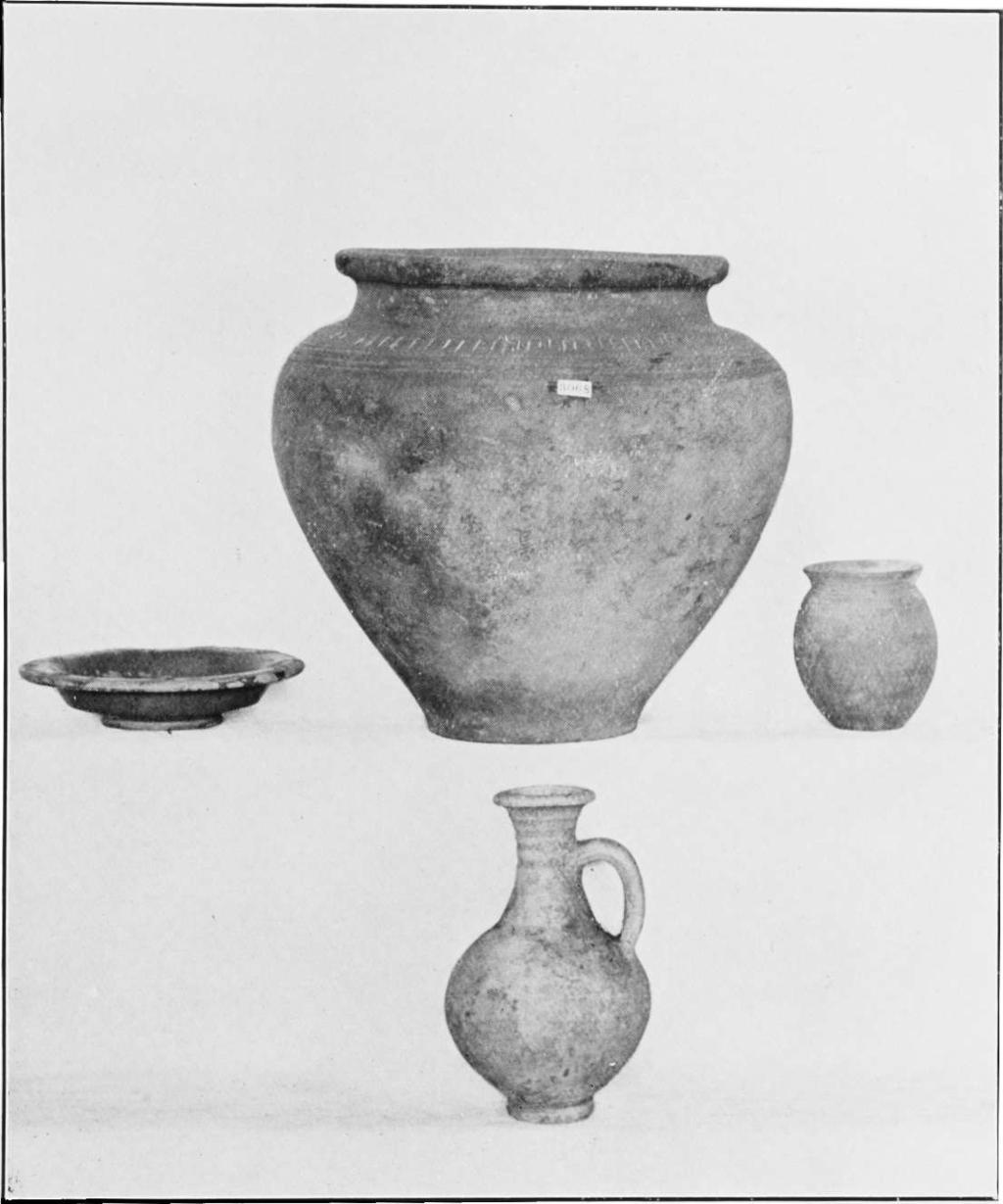 Plate I. Burial Group 1. Four associated objects, i.e. Cinerary Urn, Jug, Beaker, and Samian Ware Dish.