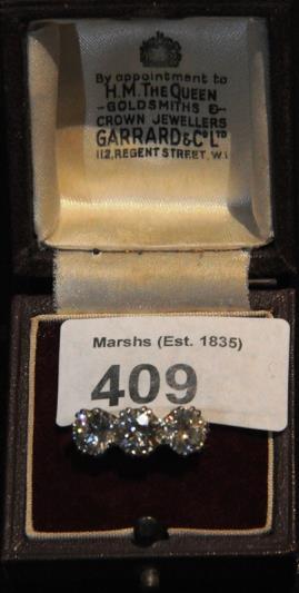 409. A Large Antique three stone Diamond Ring Set in Platinum. 410. Diamond 9ct. Gold Ring. 411. Diamond 9ct. Gold Ring. 412. Diamond 9ct. Gold Ring. 413. Diamond 9ct. Gold Ring. 414. Diamond 9ct. Gold Ring. 415.
