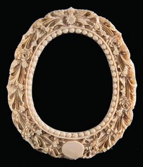 612 A late 19th century Cantonese carved ivory photograph frame of