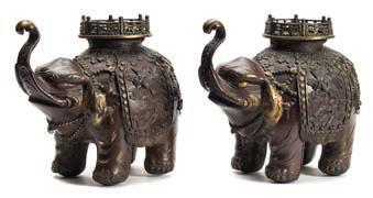 * 500-700 619 A pair of Japanese patinated bronze elephant incense burners each caparisoned
