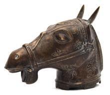 * 200-250 642 642 An Indo-Persian bronze study of a horse s head with open mouth and pricked ears, incised with foliate decoration,