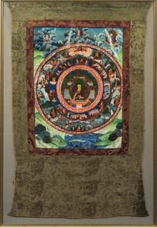 * 200-300 644 644 A Far Eastern buddhistic thangka of traditional design, the central scene of a temple interior with Buddha seated,